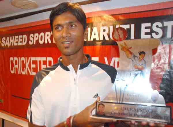 Dhiraj Singh poses with the Maruti Estate Saheed Sporting Cricketer of the Year Award   in Bhubaneswar on April 11, 2010.