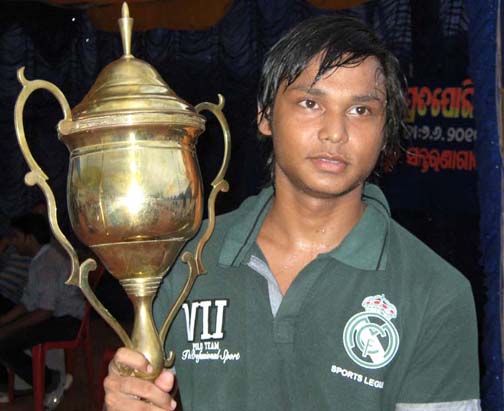 Chintan Naik with the trophy as best swimmer of Orissa in Bhubaneswar on June 7, 2010.