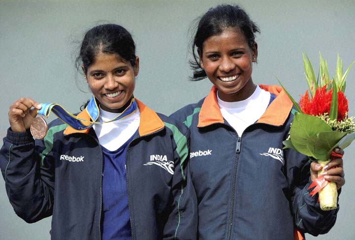 Orissa rowers Pratima Puhana (Left) and Pramila Prava Minz pose after winning bronze medal in 16th Asian Games at Guangzhou on November 19, 2010.