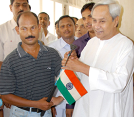 Chief Minister Naveen Patnaik wishes Ganesh Jena good luck for his Mount Everest expedition on March 30, 2011.