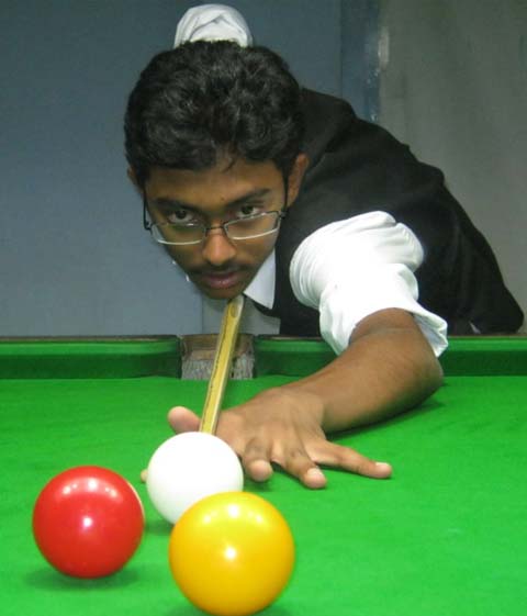 Ashutosh Padhy in action at the State Billiards and Snooker Championship in Bhubaneswar on June 18, 2011.