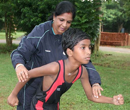 Budhia Singh getting tips from coach Rupanwita Panda in Bhubaneswar on July 30, 2011.
