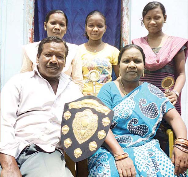 File photo of Odisha weightlifters Jayanti Devi with her husband and three daughers.