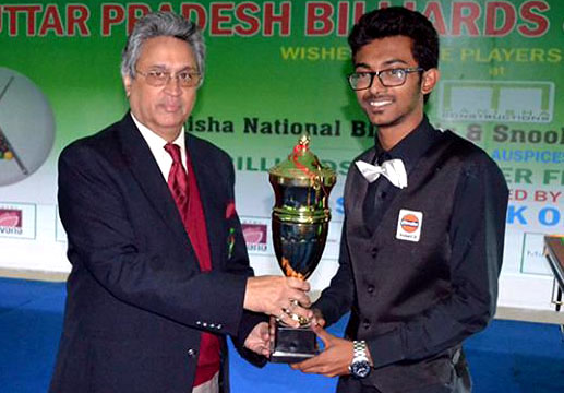 Ashutosh Padhy receives the junior National snooker trophy in Lucknow on February 23, 2014.