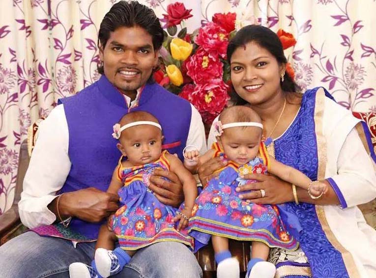 Hockey internatiironal Prabodh Tirkey with his wife Sweta and their twin daughters in October, 2014.
