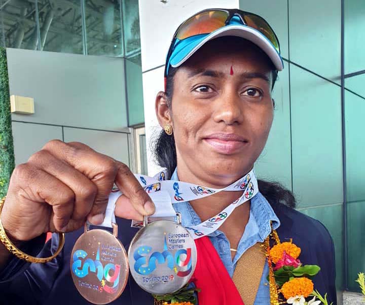 Odisha woman athlete Parbati Sethi poses with her silver and bronze medal, bagged at the European Masters Games in Torino, Italy in July-August, 2019.