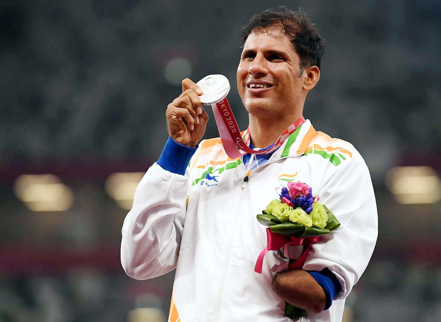 Indian javelin thrower Devendera Jhanjharia with his silver medal at the Tokyo Paralympics on 30 August 2021.