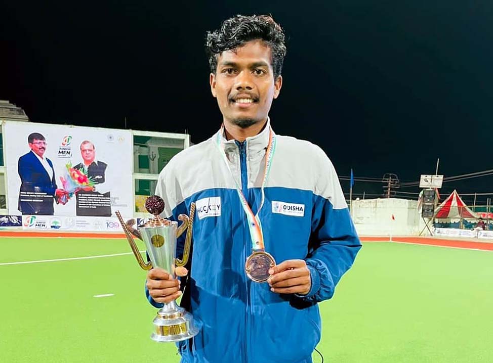 Odisha hockey player Sushant Toppo with the bronze medal he won at the 11th Hockey India Junior Men National Championship in Kovilpatti, Tamil Nadu on 25 December 2021.