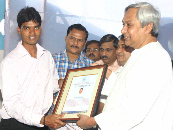Chief Minister Naveen Patnaik felicitates Orissa`s pride and India men`s hockey captain Prabodh Tirkey at Kalinga Stadium Swimming Complex in Bhubaneswar in 2008.