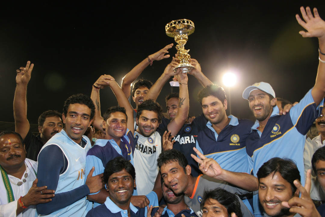 India Blue team lifts the NKP Salve Trophy after winning the Challenger Series in Cuttack on Sunday.