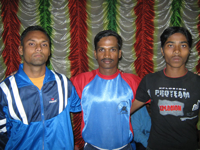 Nilamani Sahu (Left), Pradip Kumar Sahu (Centre) and G Shiva get together after winning medals in the State Powerlifting Championship in Bhubaneswar on December 6, 2008.
