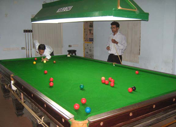Cueists practise on the english table of the newly launched Cue Sport Academy in Bhubaneswar on April 16, 2009.