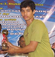 Orissa`s <b>Anshuman Behera </b>takes the best sub-junior fighter trophy at the Kickboxing Nationals in Bhubaneswar on <b>Oct 4, 2009.