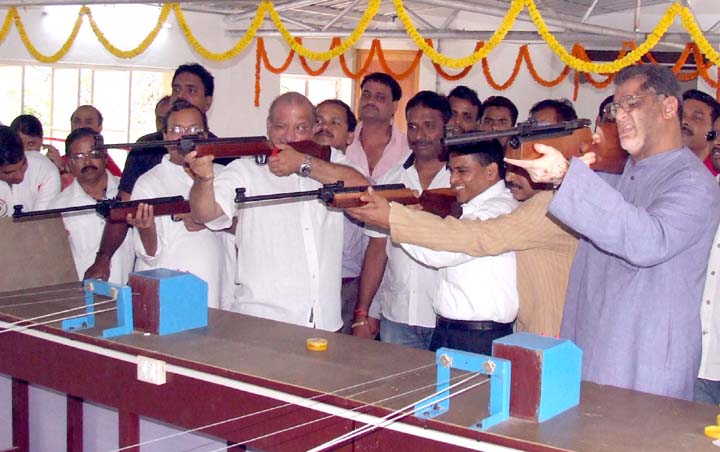 Ministers aim for the target at the new indoor shooting range in Bhubaneswar on March 17, 2010.