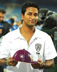 India spinner Pragyan Ojha poses with the purple cap after becoming the highest wicket-taker of IPL in April 2010.