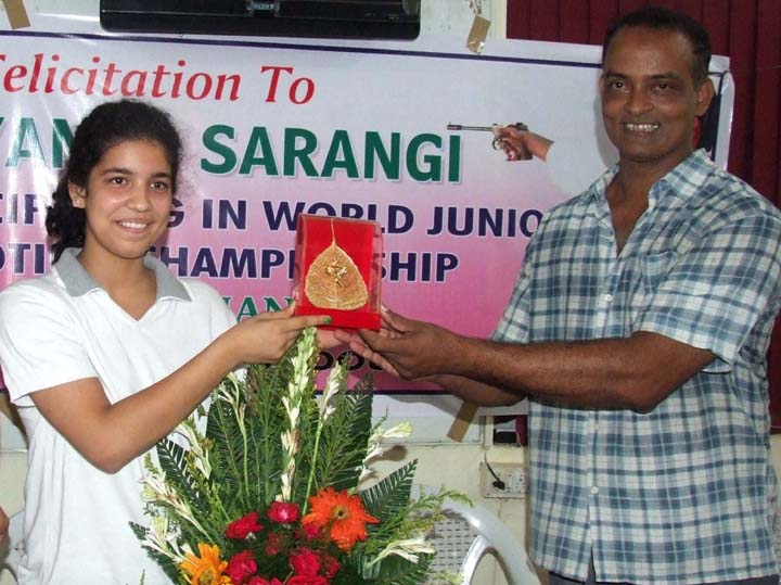 Utkal Karate School founder H P Pattanayak felicitates international shooter Shriyanka Sadangi (left) in Bhubaneswar on June 26, 2010.