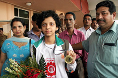 Padmini Rout show her Asian Youth Chess Championship gold medal on arriving in Bhubaneswar on 23rd July, 2008.