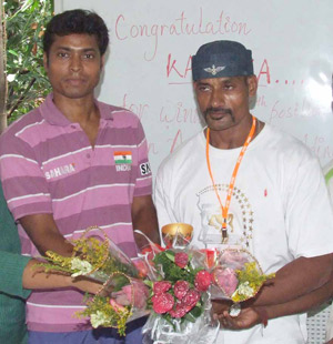 Hockey Olympian Dilip Tirkey felicitates bodybuilding international Kartikeswar Jena in Bhubaneswar on 25th July, 2008.