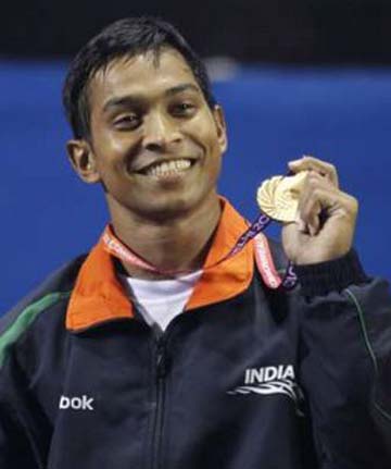 Weightlifter K Ravi Kumar displays his Commonwealth Games gold medal in 2010.