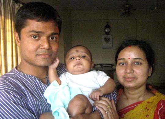 Sports journalist Tapan Mohanta with wife Rinky and son Pranayaditya at home in Kolkata on March 16, 2011.