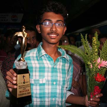 Ashutosh Padhy with his Sub-junior National Snooker title in Bhubaneswar on August 4, 2011.