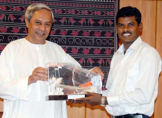 Hockey Olympian Ignace Tirkey with Chief Minister Naveen Patnaik in Bhubaneswar on May 26, 2010.