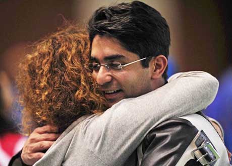 Abhinav Bindra gets a hug from his coach after winning the first-ever individual Olympic gold medal in Beijing on August 11, 2008.