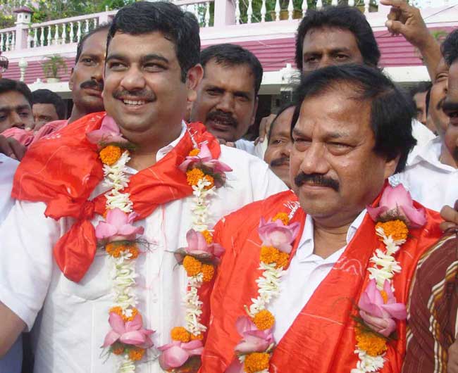Ranjib Biswal (left) and Asirbad Behera celebrate after their victory in the Orissa Cricket Association election at Cuttack on August 17, 2008.