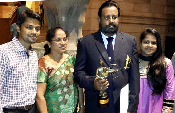 Dronacharya Award winning rowing coach Jose Jacob with his family in New Delhi on August 29, 2014.
