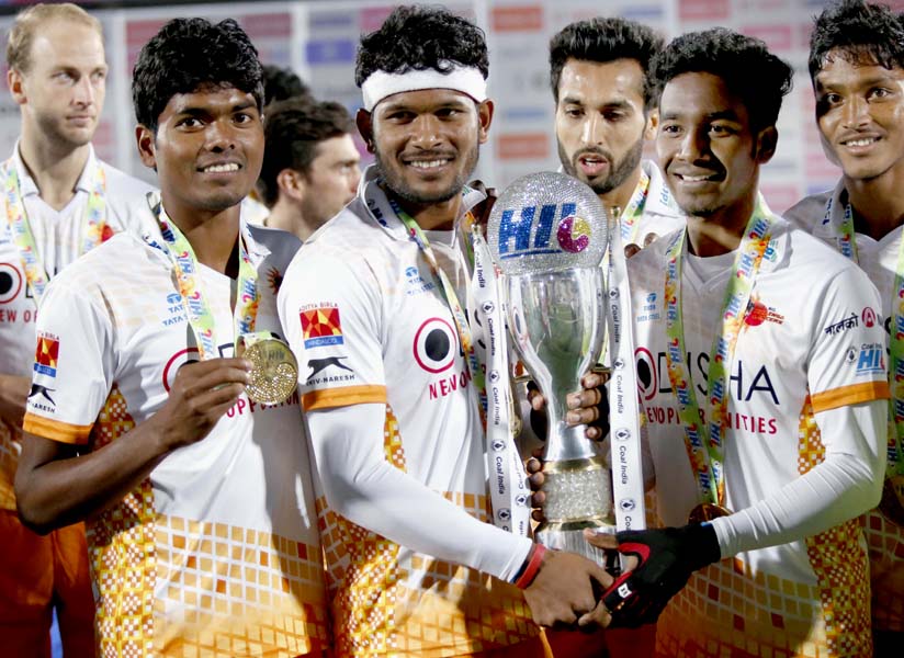 Kalinga Lancers’ Odisha players (L to R) Nilam Sanjeep Xess, Amit Rohidas, Dipsan Tirkey and Anand Lakra with the Hockey India League trophy in Chandigarh on Feb 26, 2017.