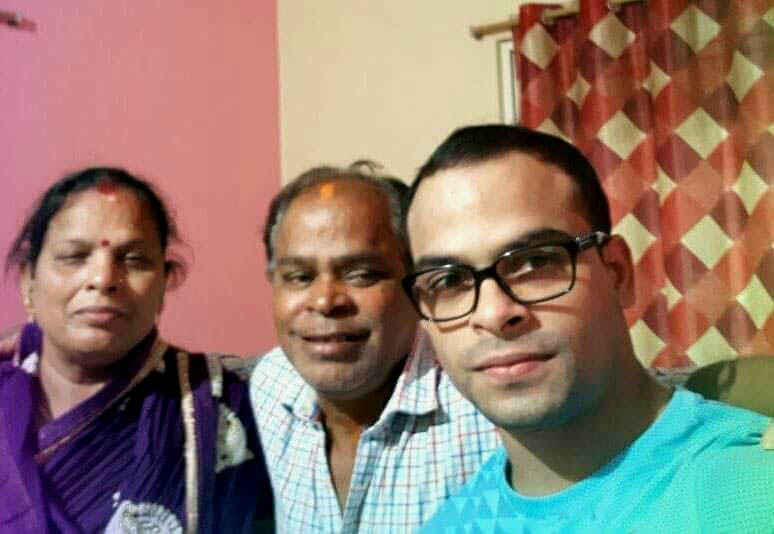 Odisha international gymnast Rakesh Kumar Patra with his parents at their Puri home on May 4, 2018.