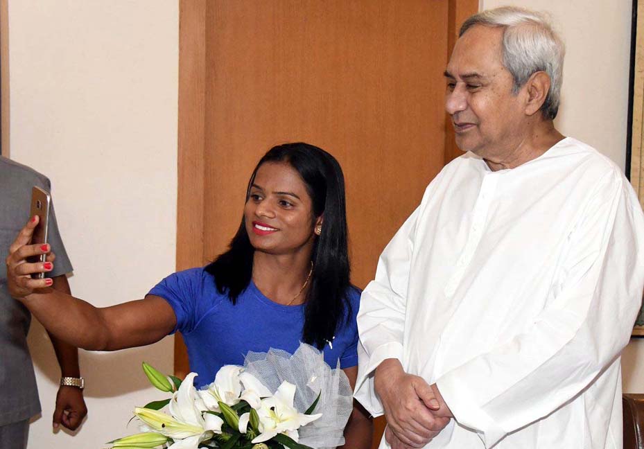 Dutee Chand takes a selfie with Chief Minister Naveen Patnaik in Bhubaneswar on July 4, 2018. The CM felicitated Dutee on the occasion for setting new national record in 100m sprint and getting qualified for Asian Games 2018.