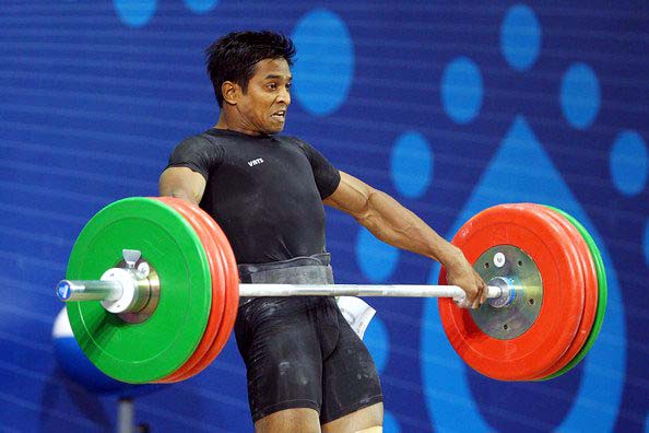 Odisha weightlifter K Ravi Kumar lifts for gold medal at the 19th Commonwealth Games in New Delhi on 6 October, 2010.