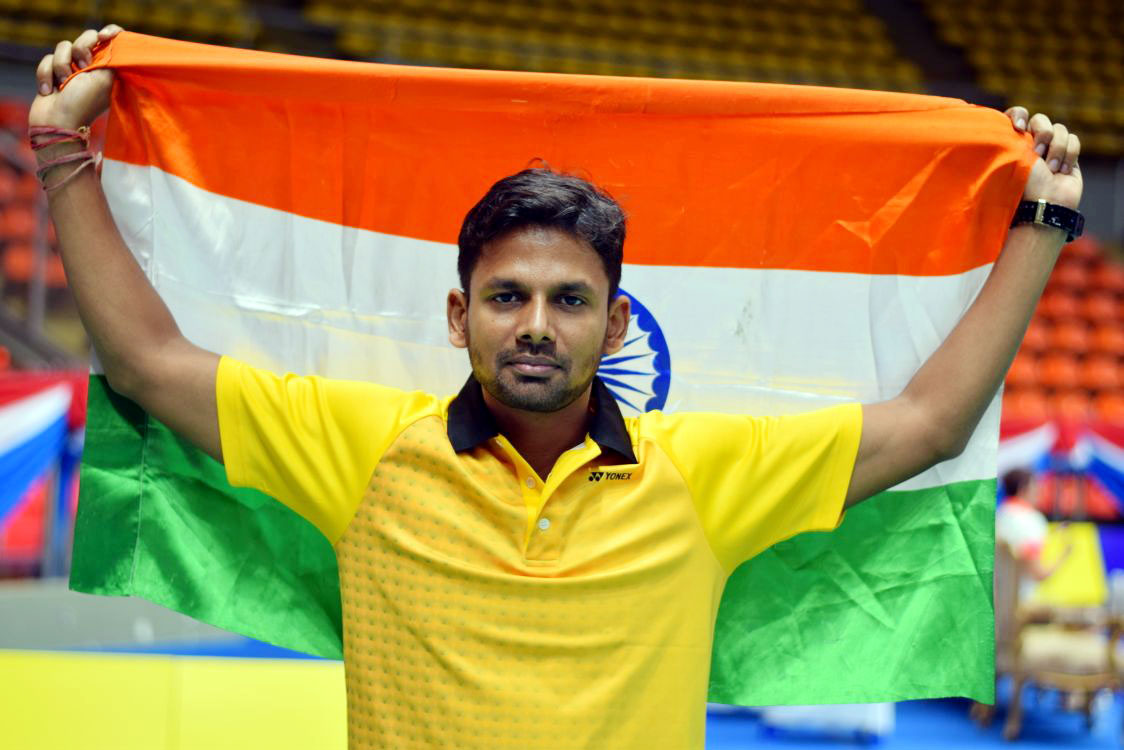 Undated file picture of Odisha para-badminton international Deep Ranjan Bisoyee with the National flag.