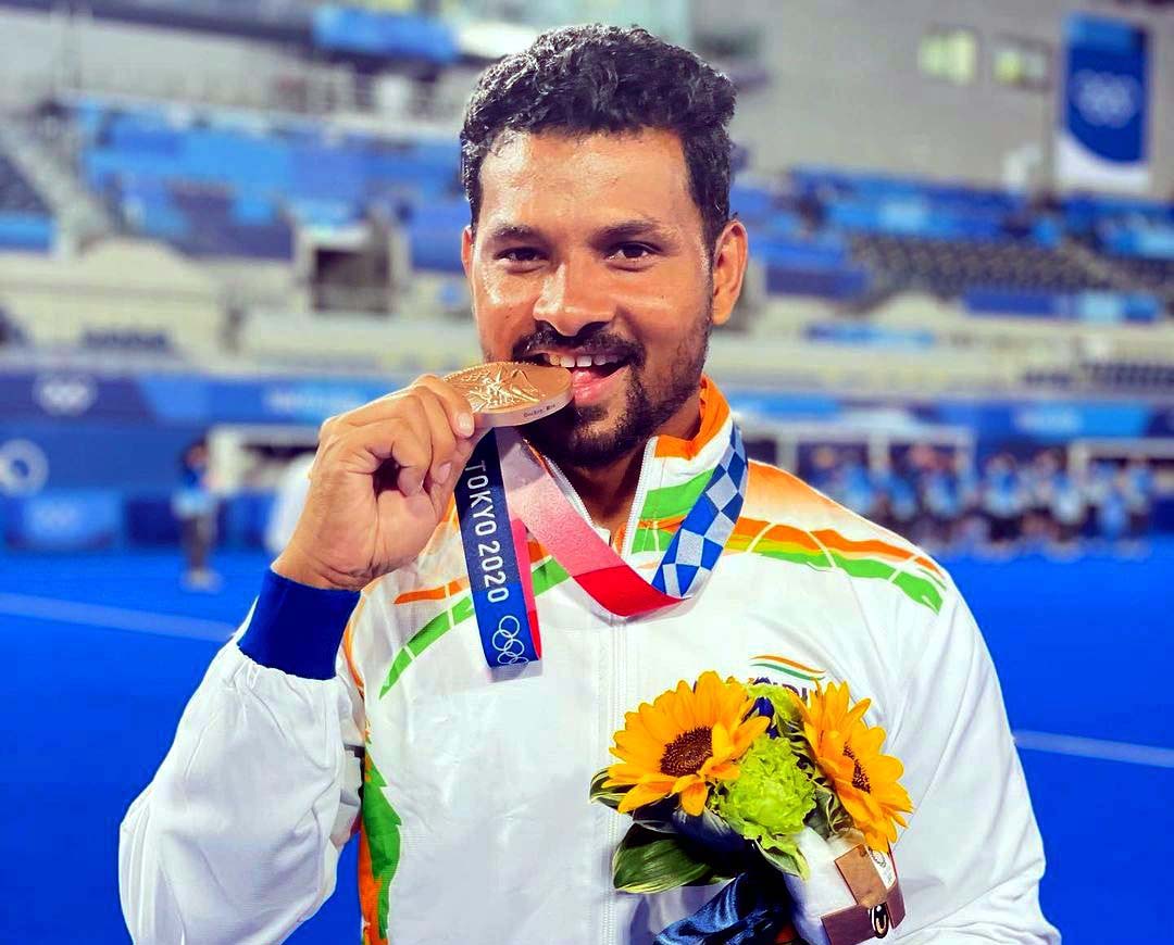 Odisha hockey international Birendra Lakra with his bronze medal at the Tokyo Olympics in Tokyo on 5th August, 2021.
