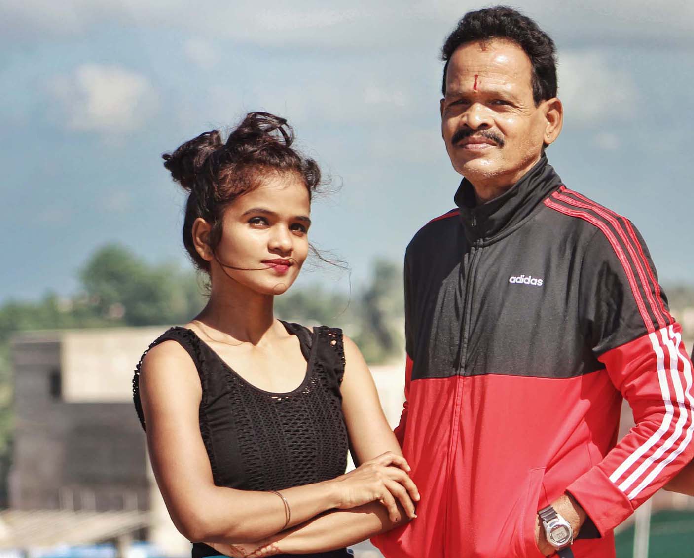 Undated file picture of Odisha woman yogasana athlete Recky Prava Ray with her father Madhusudan Ray.