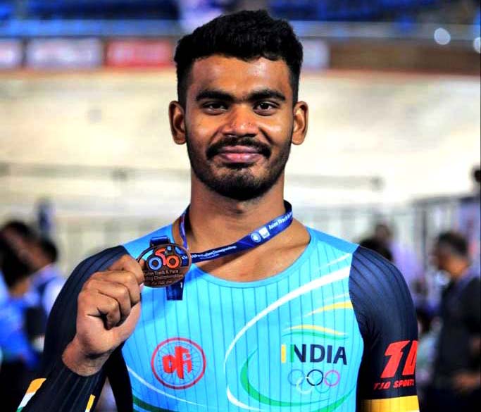 Odisha cyclist Dinesh Kumar displays his senior men team pursuit bronze medal at the Asian Track Championship in New Delhi on 18 June 2022.