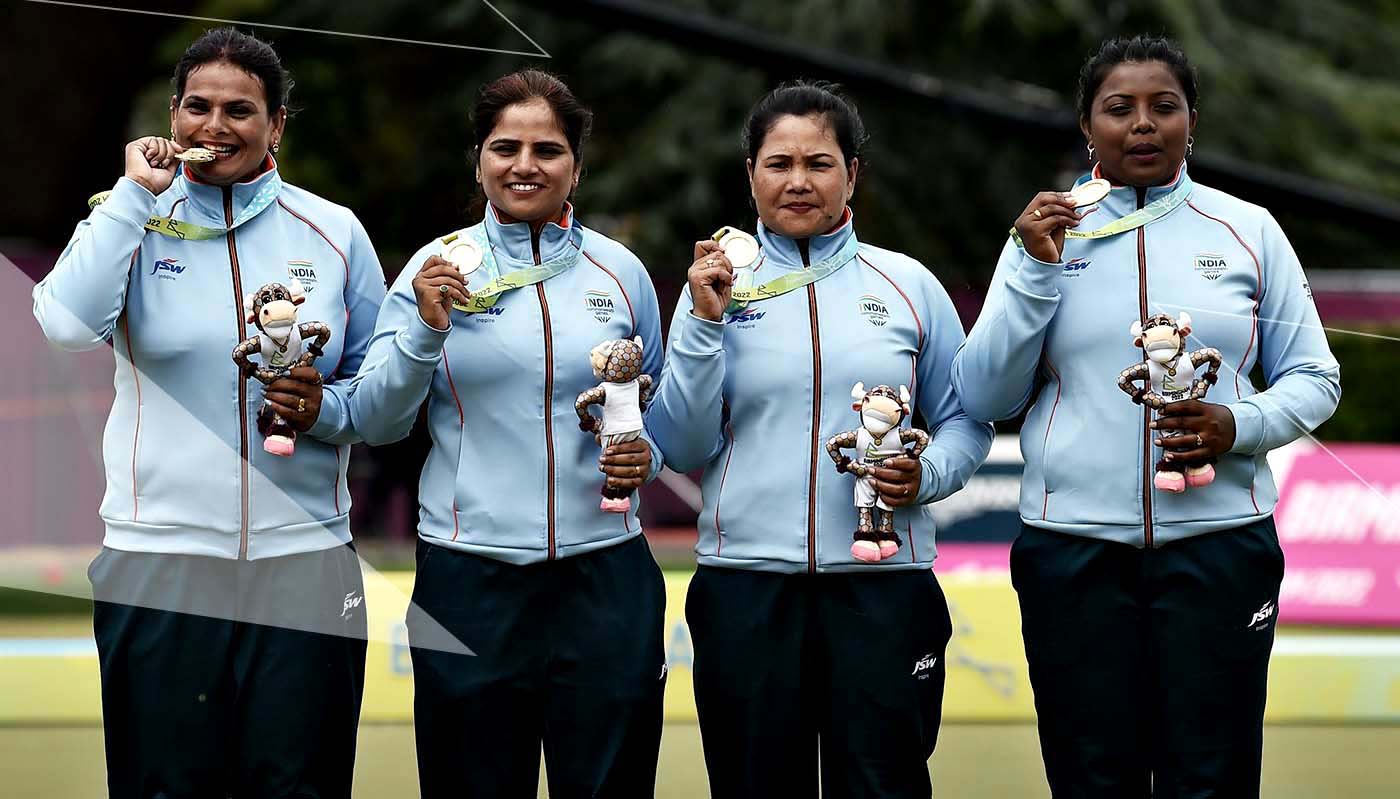 Players of Indian women-four team (L-R), Pinki, Lovely Choubey, Nayanmoni Saikia and Rupa Rani Tirkey pose with their gold medal at the Commonwealth Games in Birmingham on 2 August 2022.