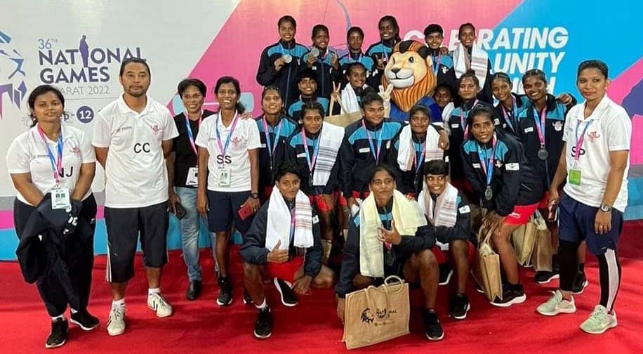 Members of the Odisha Women Football Team pose after bagging Silver medal in the 36th National Games at TransStadia in Ahmedabad, Gujarat on 10 October 2022.
