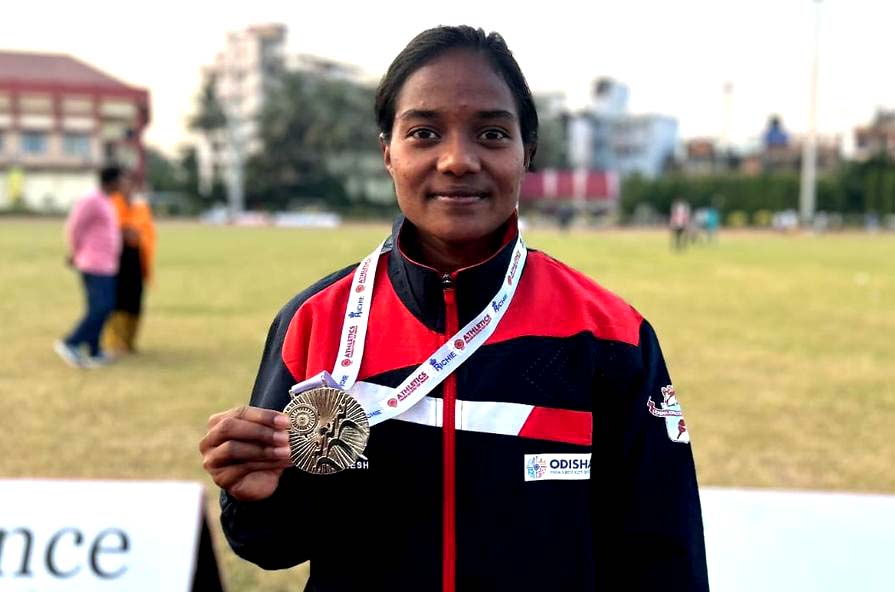 Odisha woman steeplechaser Susmita Tigga poses with her gold medal at the 37th National Junior Athletics Championships in Guwahati on 15 November 2022.