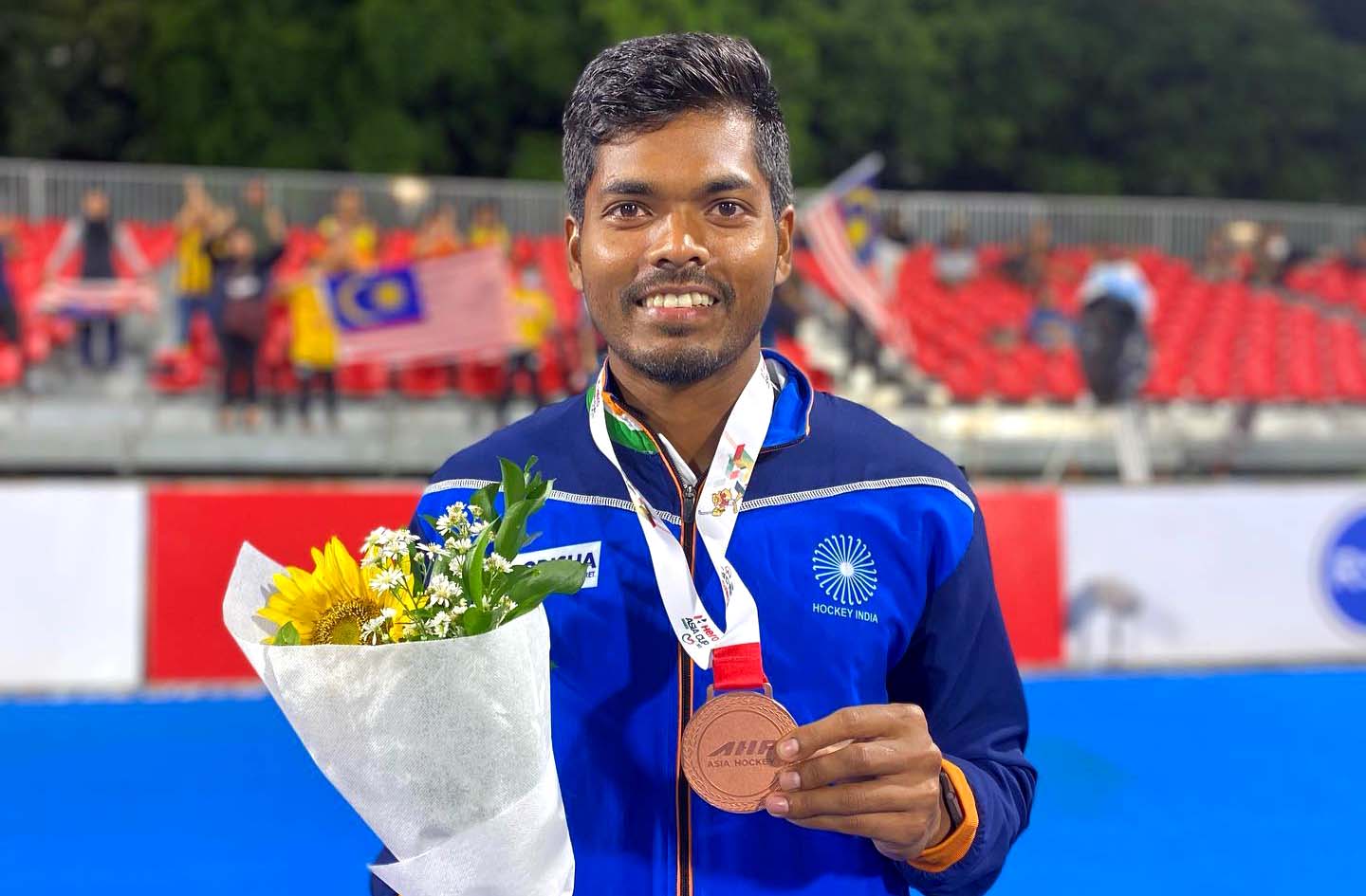 Odisha defender Nilam Sanjeep Xess poses with his Asia Cup bronze medal in Jakarta, Indonesia on 1 June 2022.