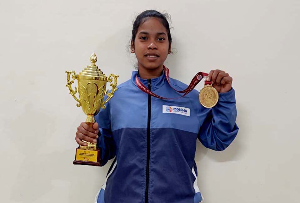 Odisha girl Jyoshna Sabar poses with the Best Lifter trophy (youth women category) and gold medal at IWLF National Weightlifting Championship, held at Nagercoil, Tamil Nadu from 29 December 2022 to 6 January 2023.
