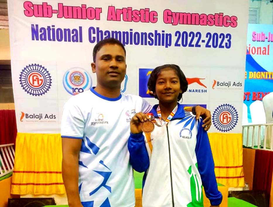 Odisha girl Dhanalaxmi Rao poses with her coach Rashmi Ranjan Reddy after winning bronze medal at the Sub-Junior National Artistics Gymnastics Championship in Kolkata on 19 February 2023.