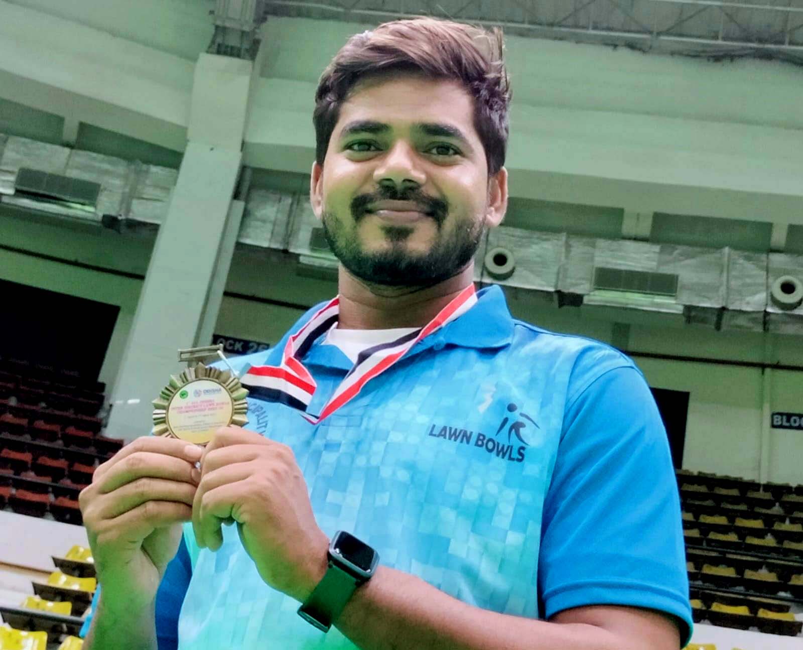 Odisha lawn bowling player Dinesh Nanda poses with his medal at the 1st All-Odisha Inter-District Lawn Bowls Championship in Cuttack on 3 April 2023.