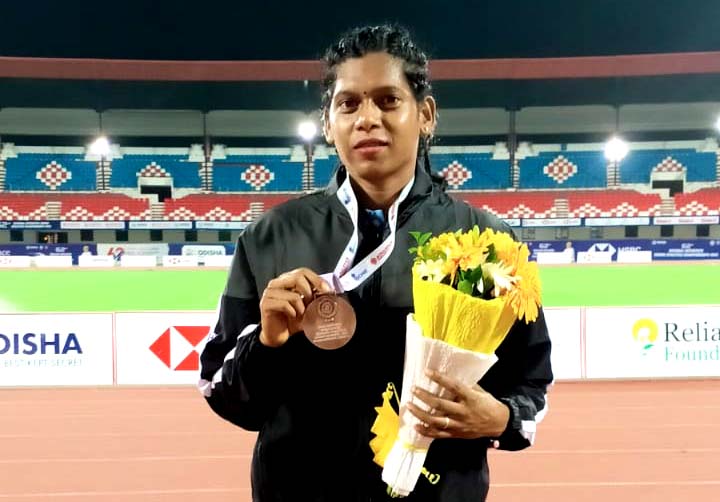 Odisha Police athlete Bonita Lakra poses with her 400m relay bronze medal in the 62nd National Inter-State Senior Athletics Championship at Kalinga Stadium, Bhubaneswar on 17 June 2023.