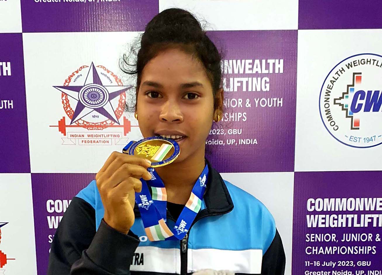 Odisha lifter Jyoshna Sabar poses with her gold medal at the Commonwealth Weightlifting Championships in Greater Noida, Uttar Pradesh on 12 July 2023.