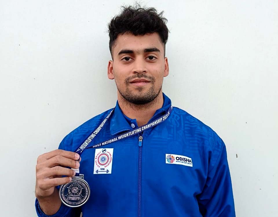 Odisha lifter Kuldeep Sahu poses with his silver medal in the IWLF National Weightlifting Championship in Itanagar, Arunachal Pradesh on 1 January 2024.