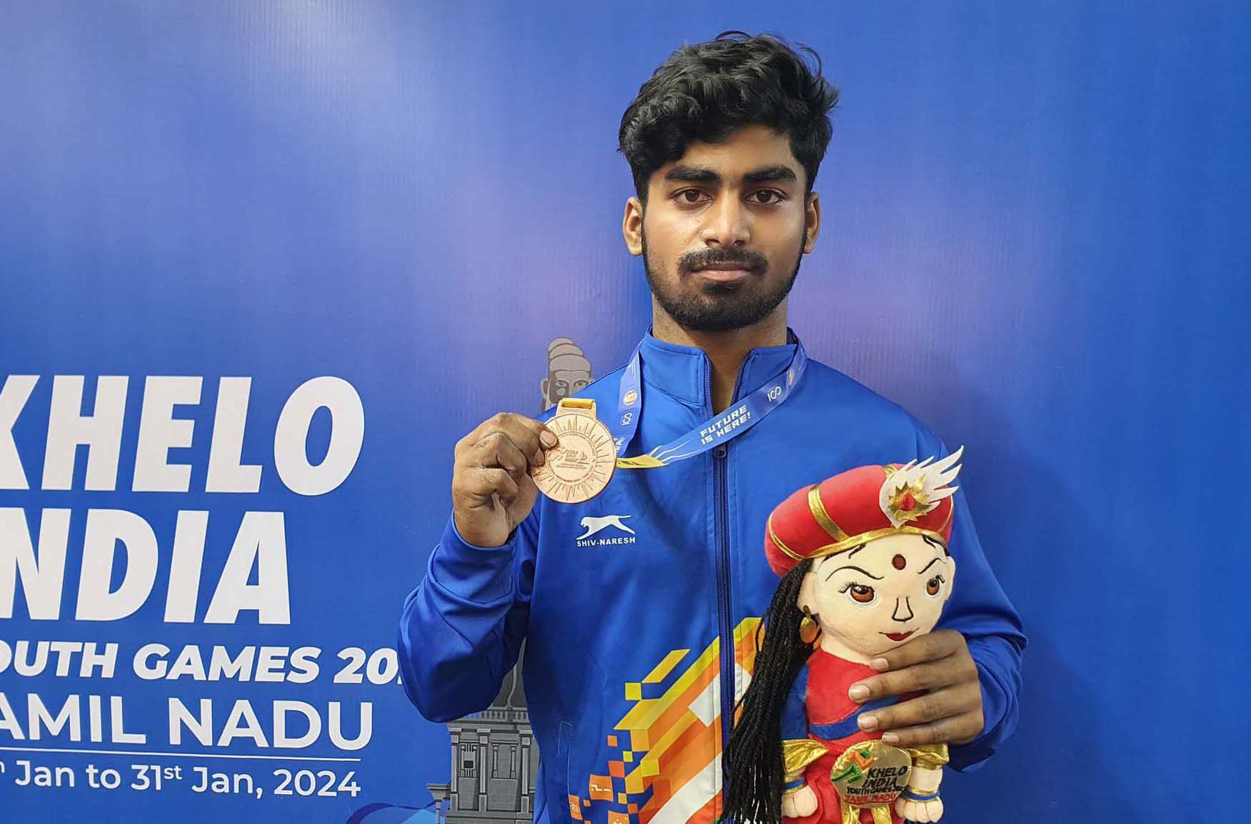 Odisha weightlifter Deepak Pradhan poses with his bronze medal at Khelo India Youth Games in Chennai on 27 January 2024.