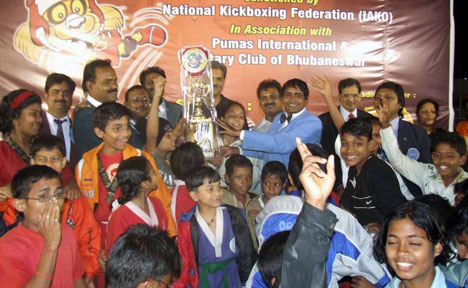 Orissa squad celebrate their success by lifting the team trophy at the closing function of the Indian Open Kickboxing Championship in Bhubaneswar on Dec 21, 2008.