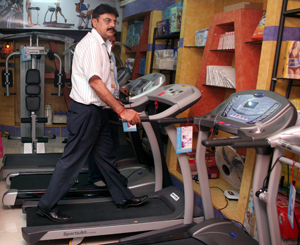 Grand Slam Fitness Managing Director Raman Sood demonstrates the functioning of a treadmill at the new exclusive showroom of the company in Bhubaneswar on May 14, 2008.